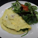 avocado-egg-omelet-with-roasted-tomatoes-in-spinach
